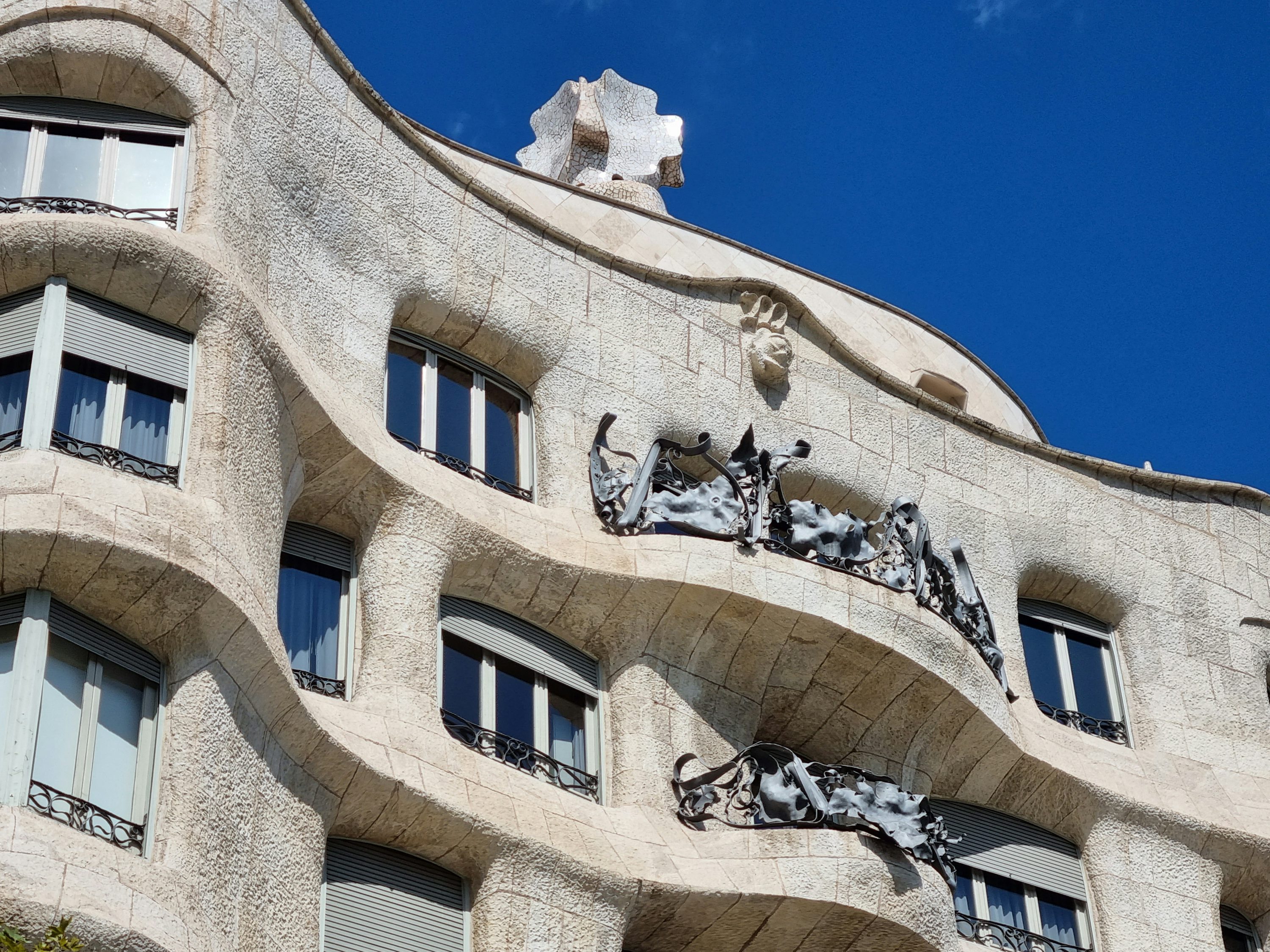 The sculpted stone façade and balconies of Casa Milà in Barcelona